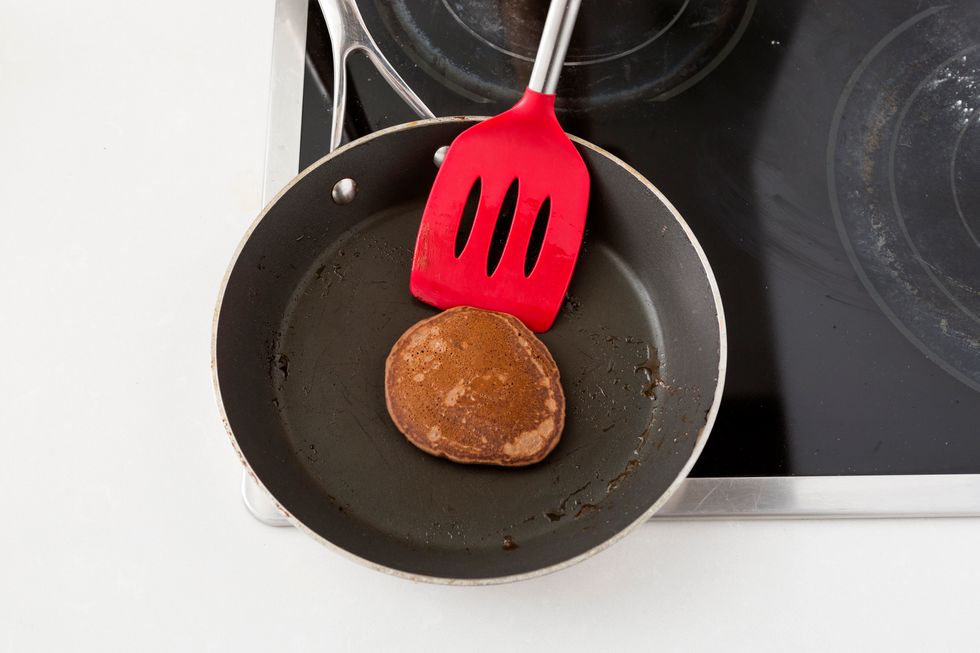 Scoop about 1/4 cup of batter onto a hot, buttered pan. Cook until you start to see bubbles forming, after a minute or so. Flip them over and cook for another minute.