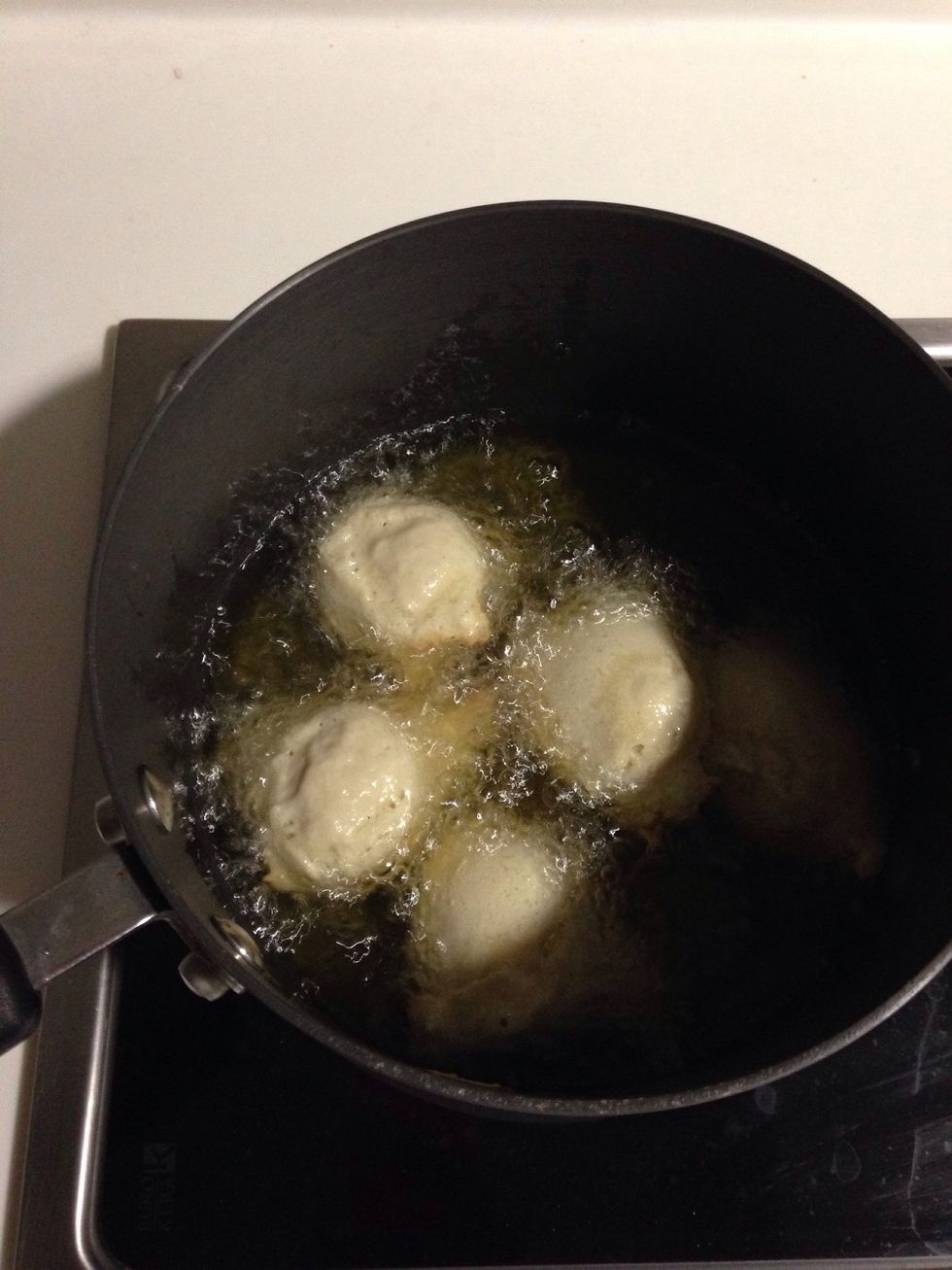 Scoop batter and put into the oil careful not to overcrowd the pot as they do rise in the oil
