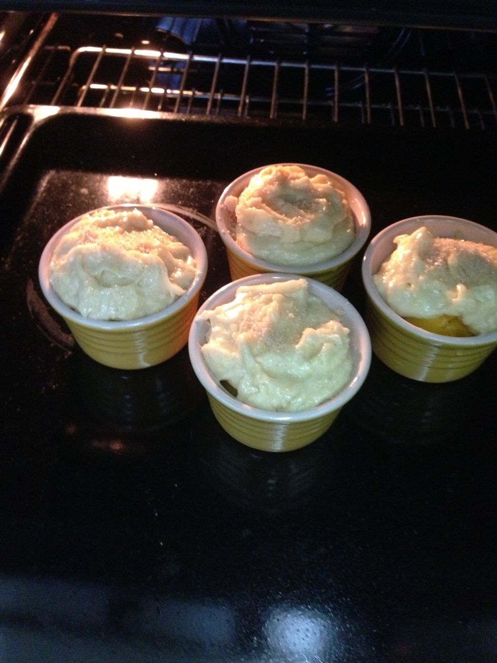 Scoop batter on top of the peaches. Bake at 200C for about 15 mins. Sprinkle some brown sugar on top of each ramekin