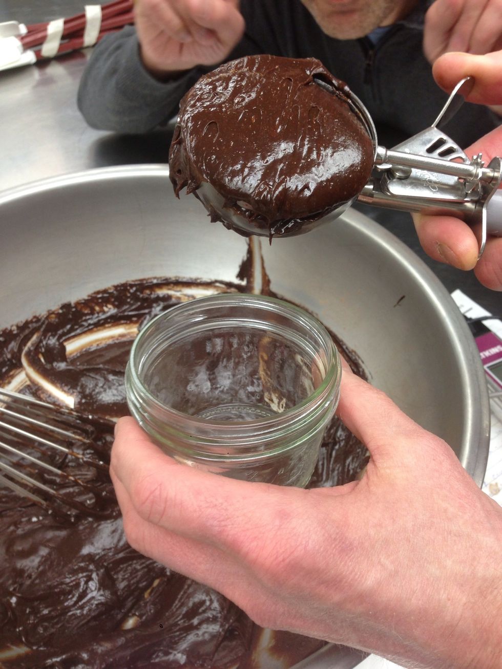 Scoop chocolate mixture into buttered and sugared mason jars.