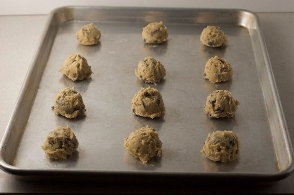 Scoop cookie dough on the greased pan and leave space in between cookies.