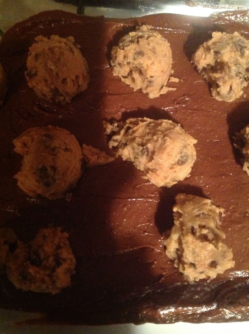 Scoop cookie mix evenly around  the brownie mix