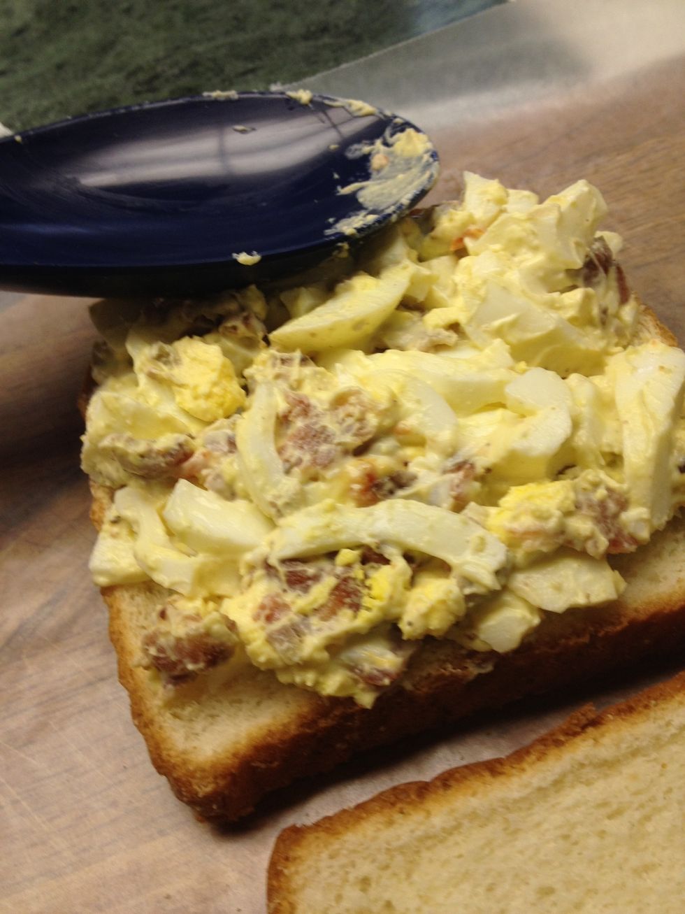 Scoop on to the bread ( white bread  is delicate and dries out very quickly, keep refrigerated until ready to use)