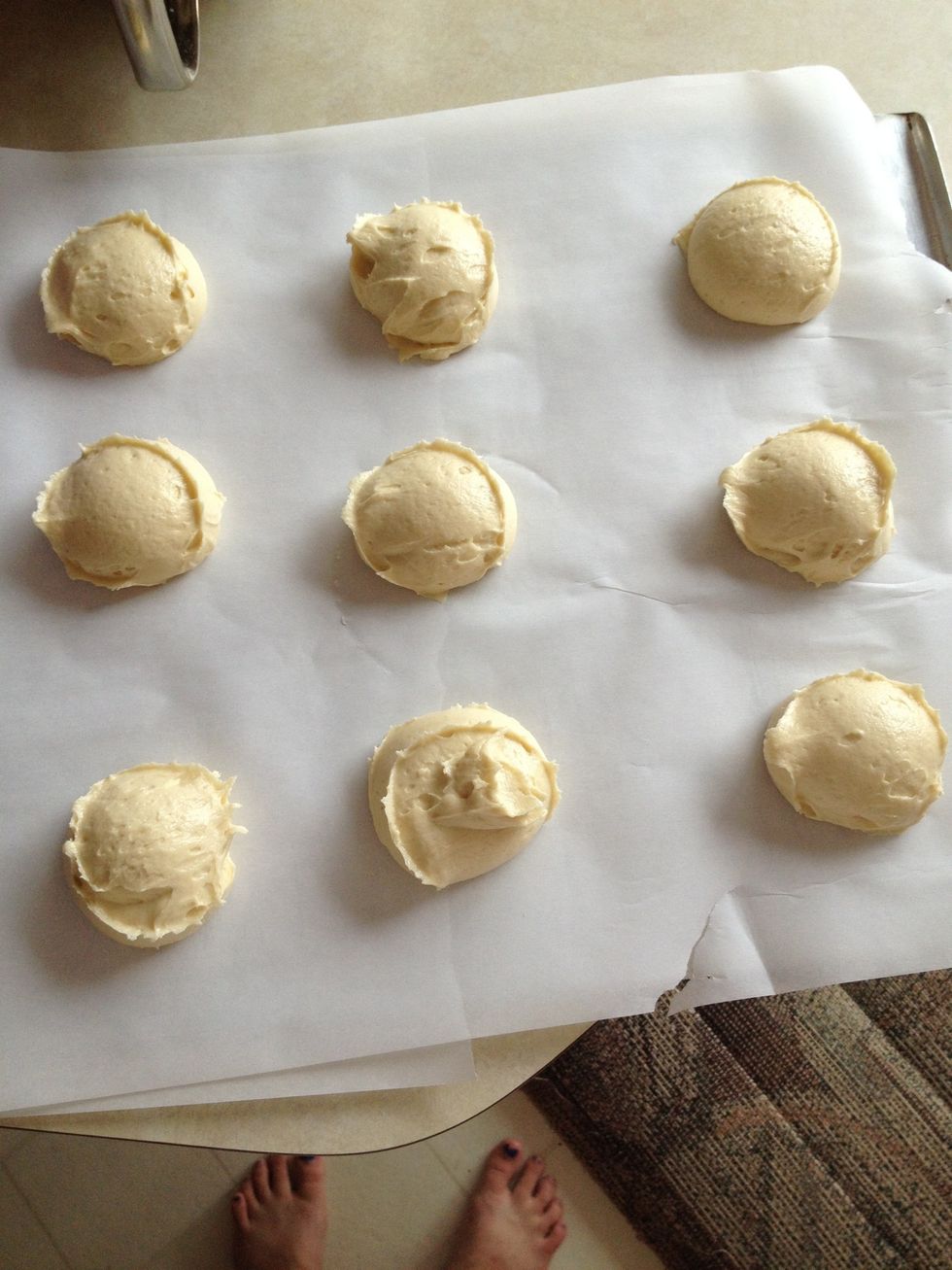 Scoop out all the cookies and dip your had in water to flatten them out. Stick in the oven and bake for 20 minutes