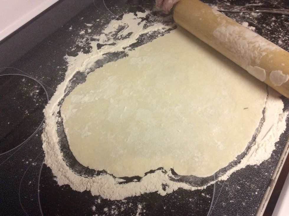 Scoop out approximately a 3rd of a cup and roll into a ball. Roll out with rolling pin (Use lots of flower on top and bottom of your dough so it doesn't stick).