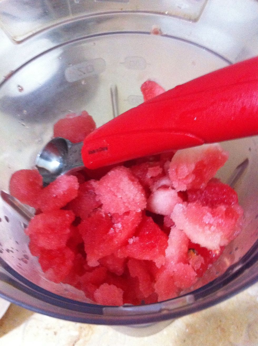 Scoop out as much watermelon as you require. If you fill a standard blender jug, it fills half of it when blended. The partially frozen watermelon is gonna give the smoothie a slushy texture