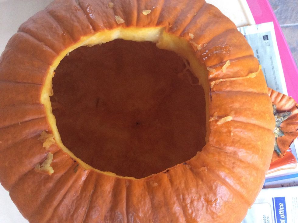 Scoop out guts with ice cream scooper and large spoon.