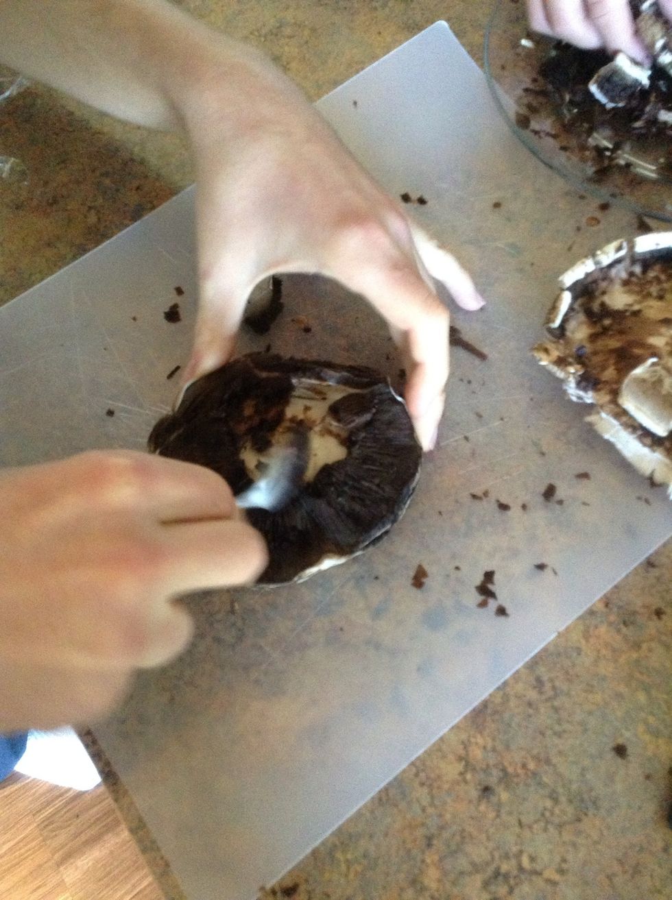 Scoop out the black gills on the bottom of the mushroom