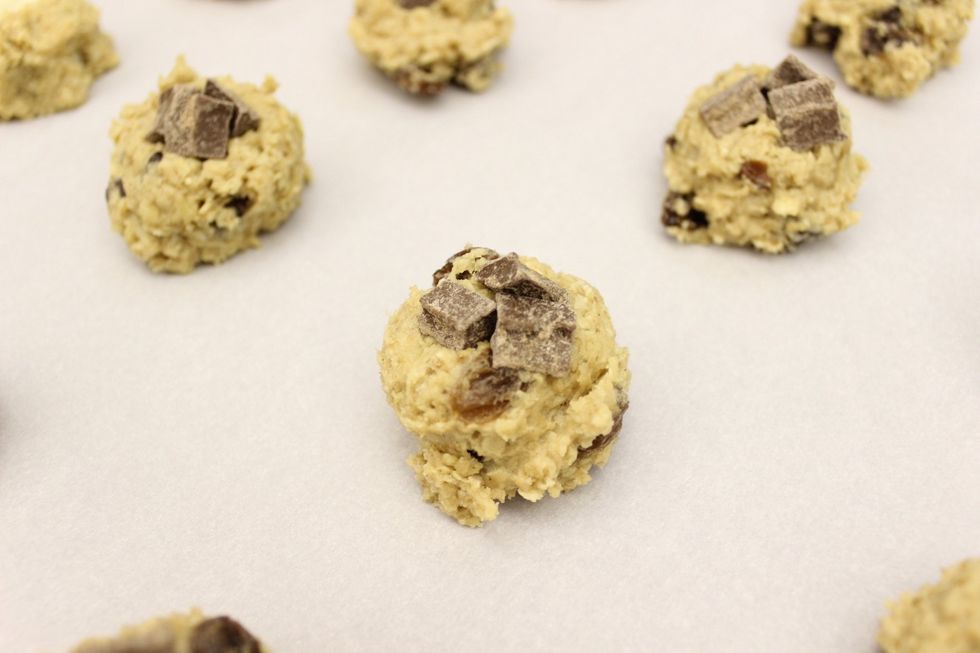 Scoop out the cookie dough and top with chocolate chunks as you did with the previous cookies. I had to top these with 3 chunks of chocolate because the chunks were smaller than the white chocolate.
