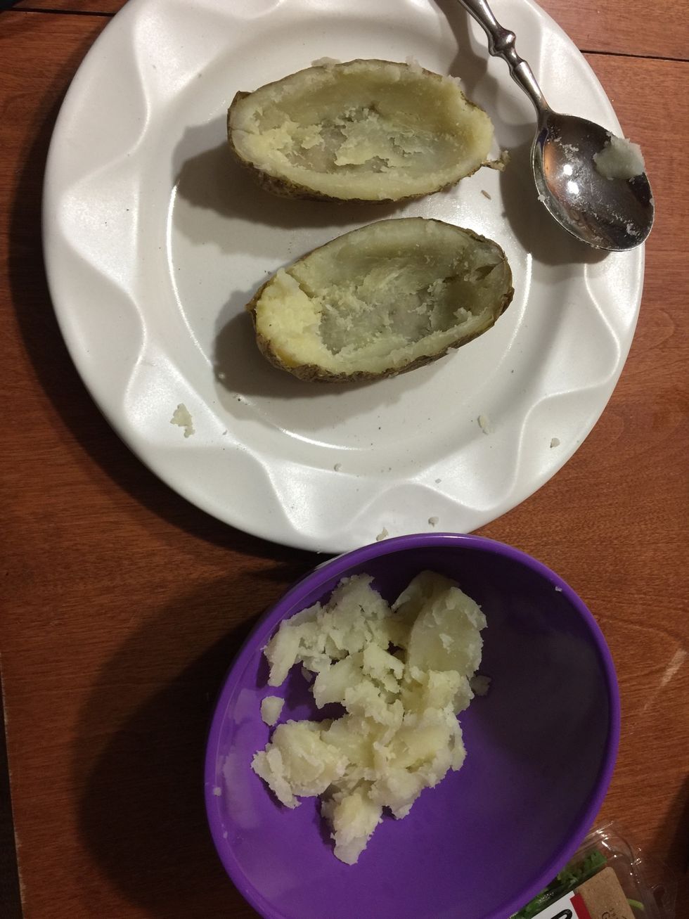 Scoop out the potato and place into a separate bowl