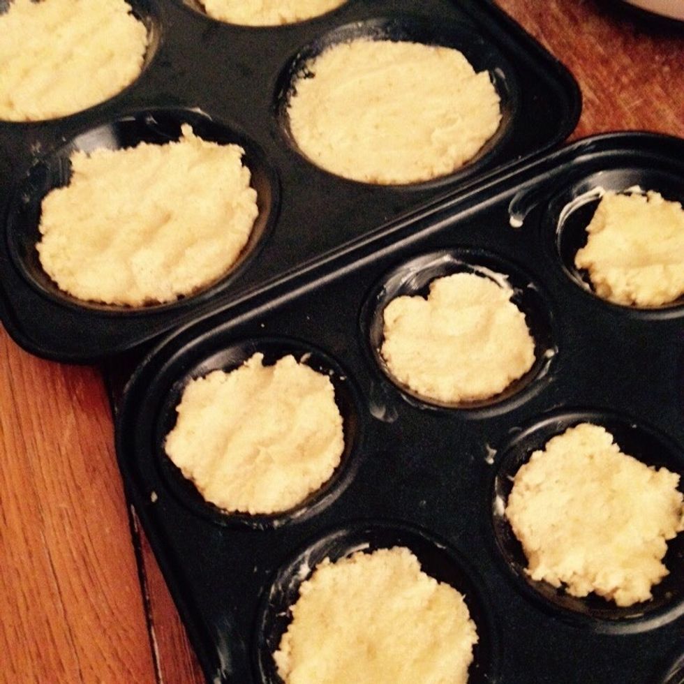 Scoop some in each of the spots, just fill them halfway as the mix will grow when baking. Bake for 10-12min in a 180C preheated oven