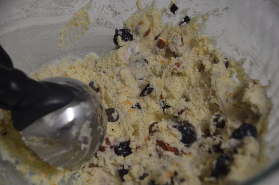 Scoop the dough using an ice cream scoop on a baking tray lined with parchment paper.