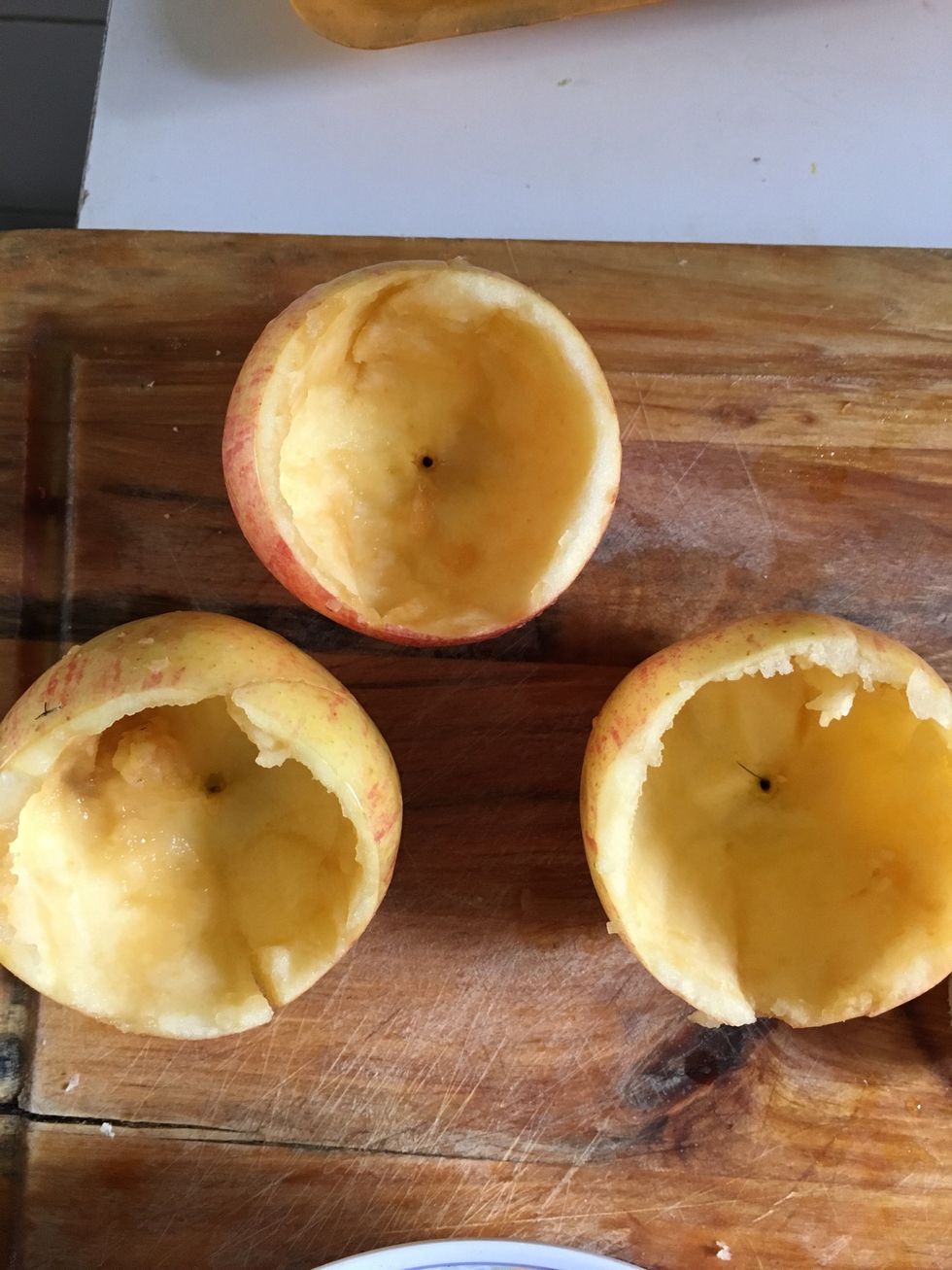 Scoop the inside of the apples (save it for later, but discard the seeds)