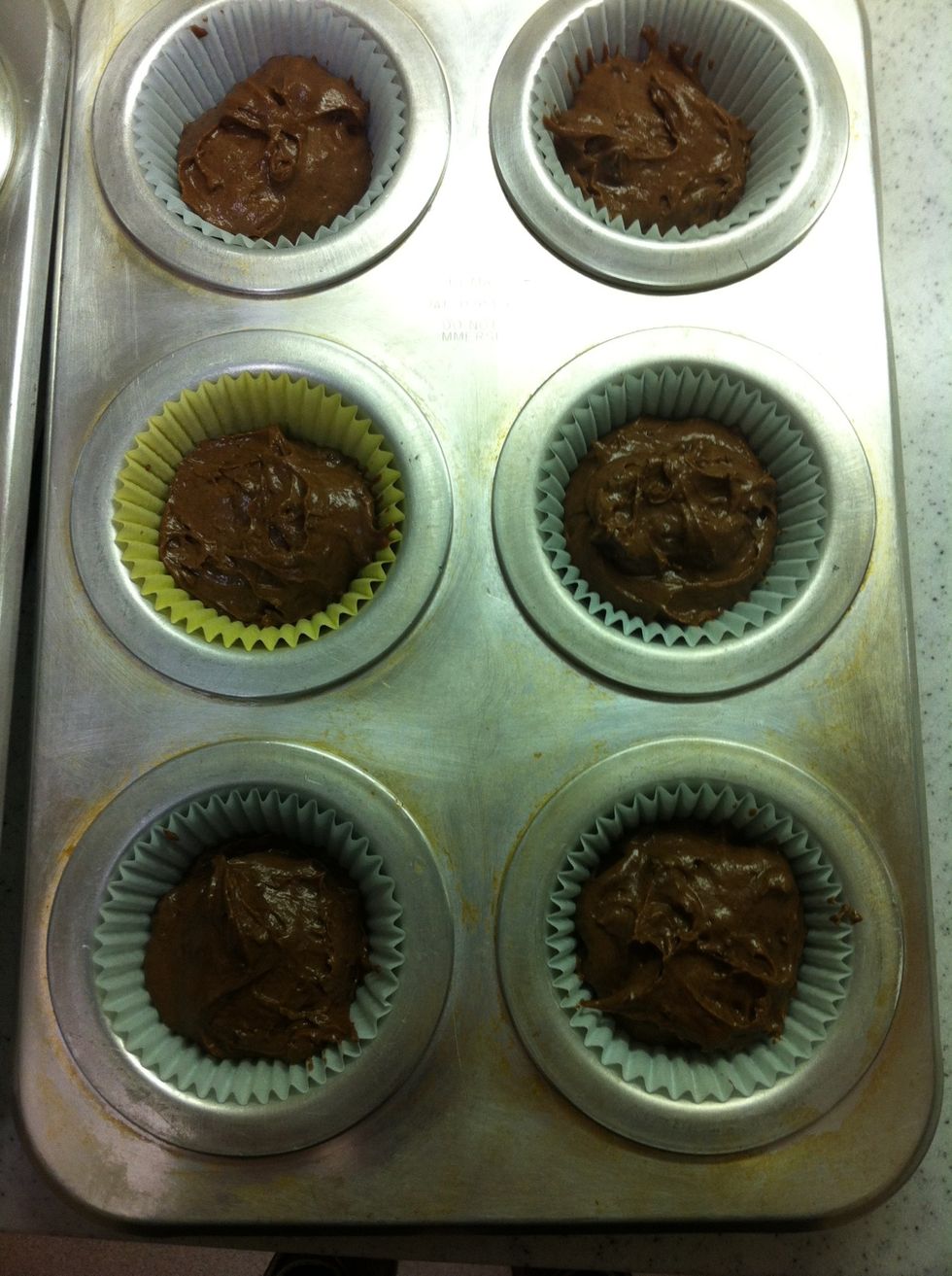 Scoop the mix into the muffin pan.