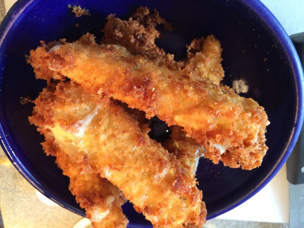 Scoop them out and place on a plate. Repeat with all the cheese sticks.