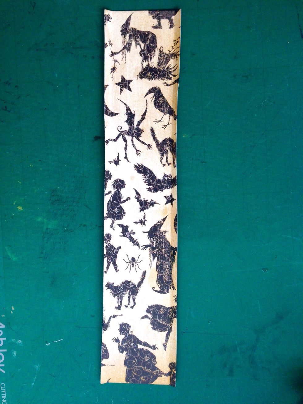 Score 0.25" at both sides of the strip as shown... This strip will serve as the connecting piece of the gift bag...