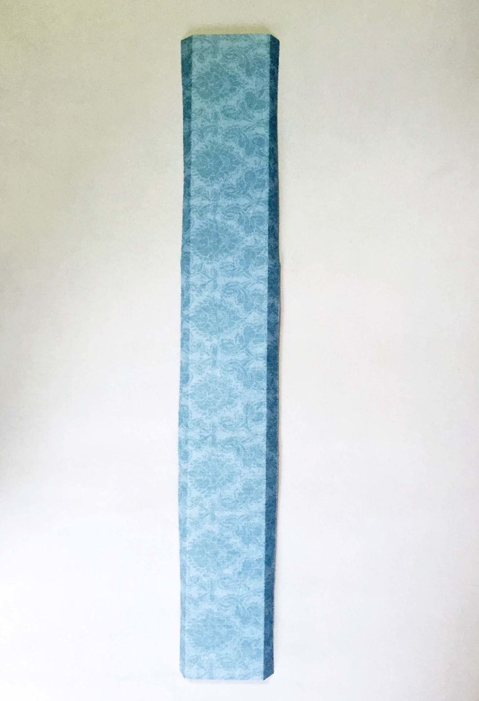 Score 0.25" on both sides and fold inwards.