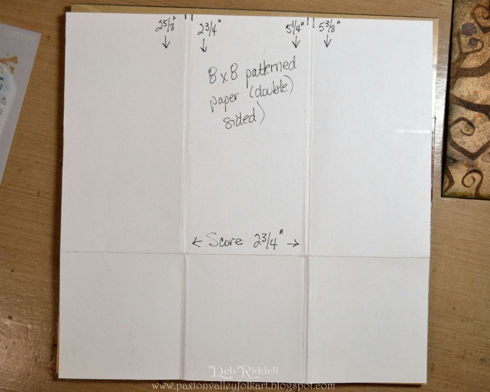 Score a piece of 8" x 8" paper from the Regions Beyond paper stash crosswise at 2 3/4" from the bottom and lengthwise at 2 5/8", 2 3/4", 5 1/4" and 5 3/8".