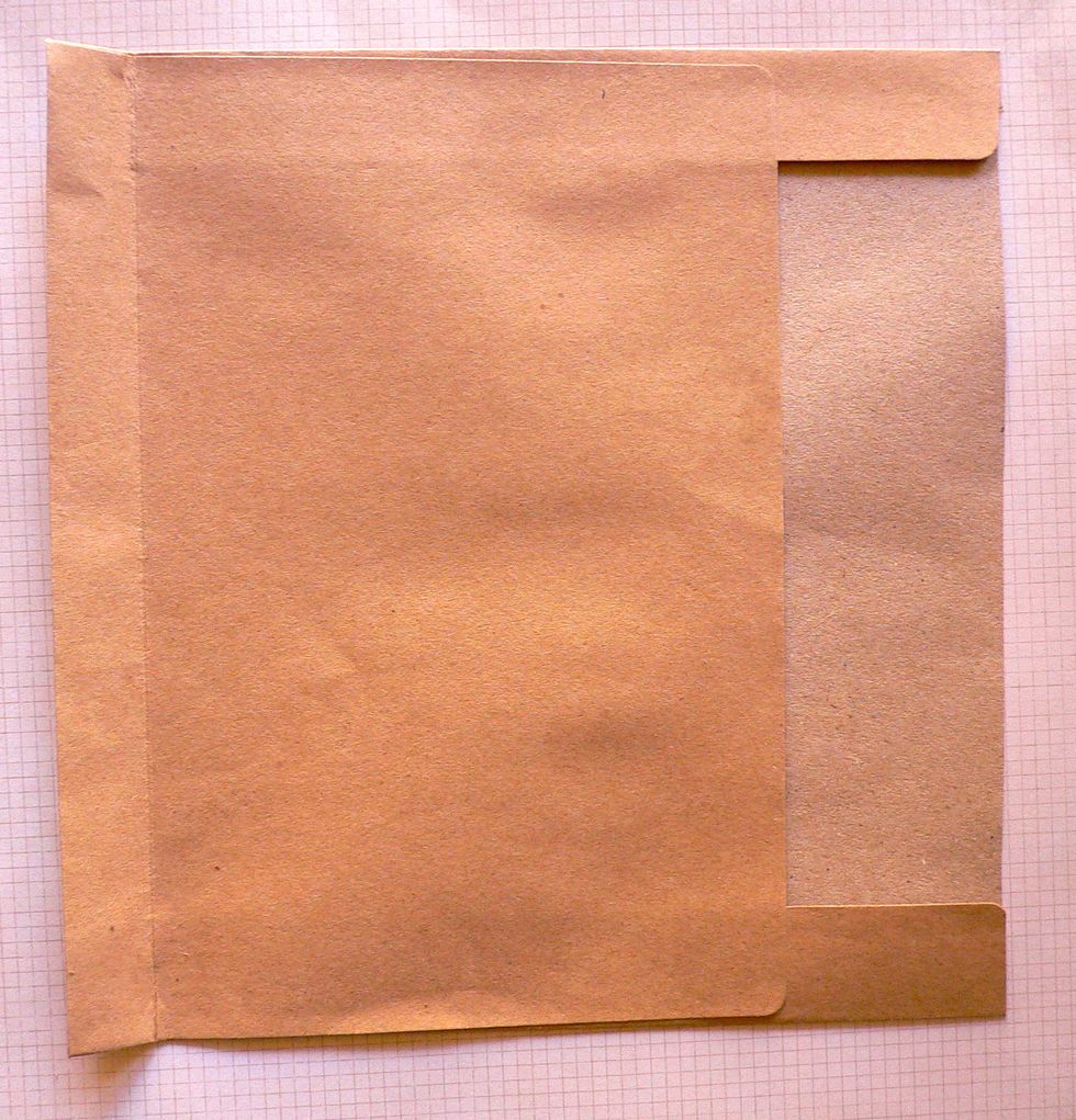 Score at 2cm from the closed edge of envelope.