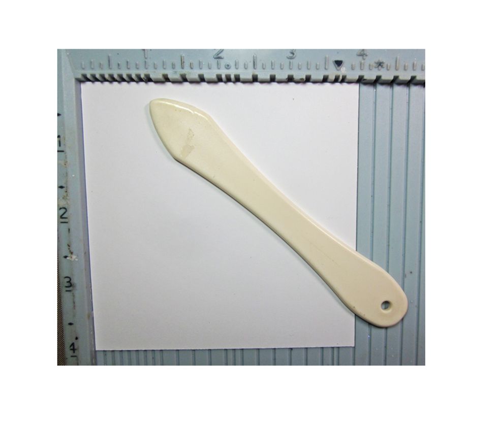 Score each square 1 inch in, on each side of the square.