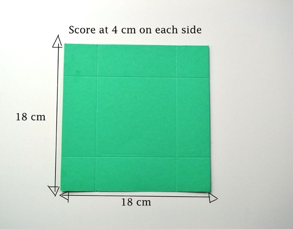 Score it at 4 cm on each side.