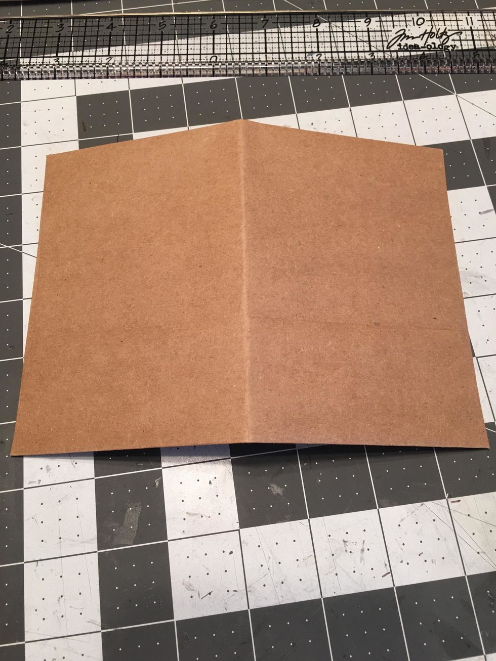 Score Kraft envelopes in half to add to the signatures.  Make sure they are not taller than your album cover.
