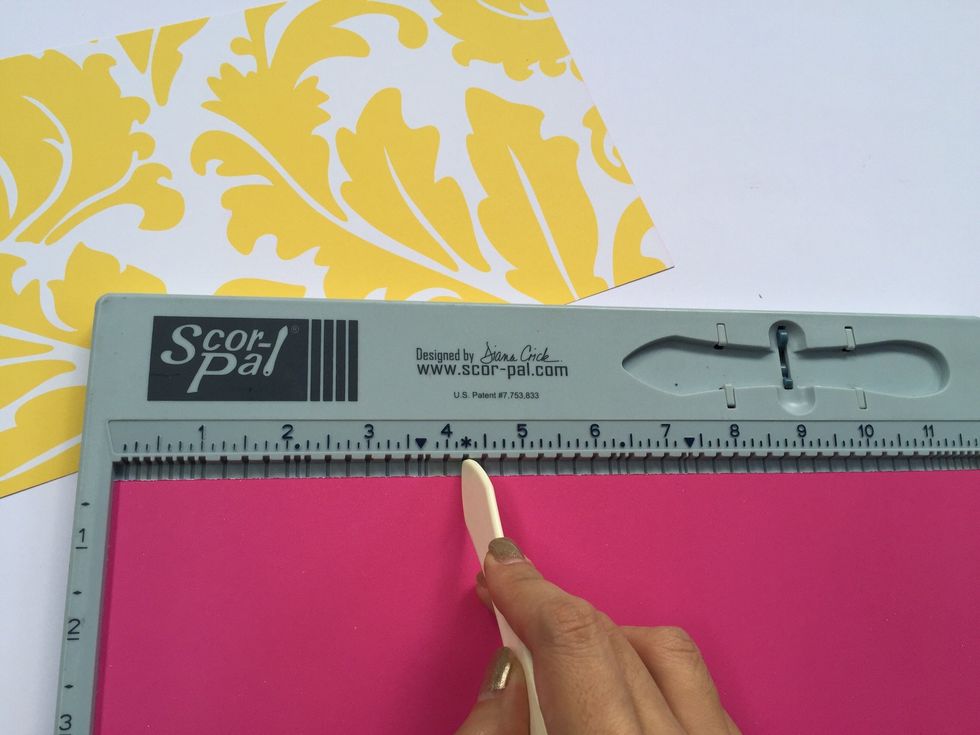 Score length wise at 4.25", 0.5" and 4.25". The remaining length of the paper of 3" forms the flap of the purse