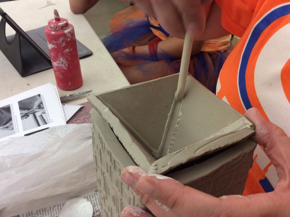 Score, slip and use coils of clay to join seams. The coil will also help fill any gaps between the slabs.