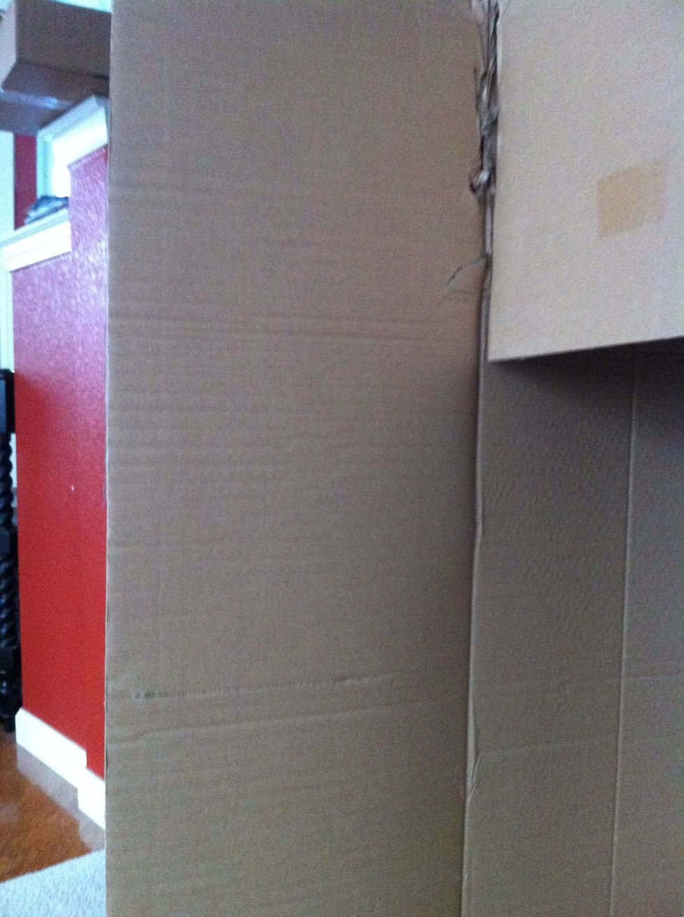 Score the board along the rib of the box to make a straight line to cut, makes it easier to cut also!