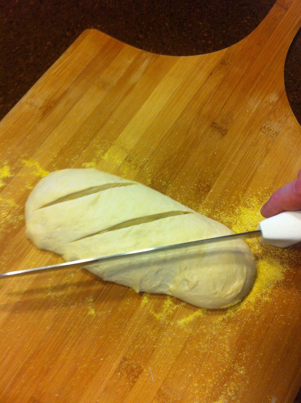 Score the dough several times with a serrated knife.