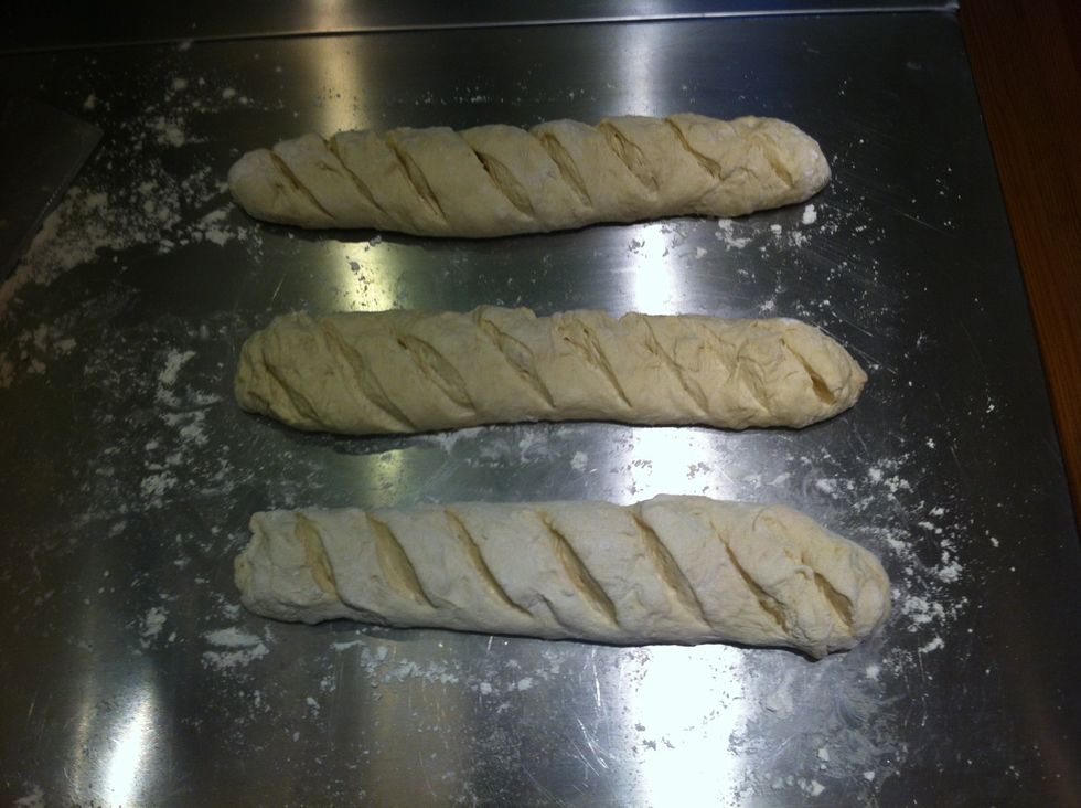 Score the loaves with a very sharp dry knife to allow room for the loaves to rise.