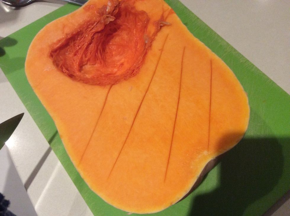 Score the pumpkin in order to allow the pumpkin to cook evenly