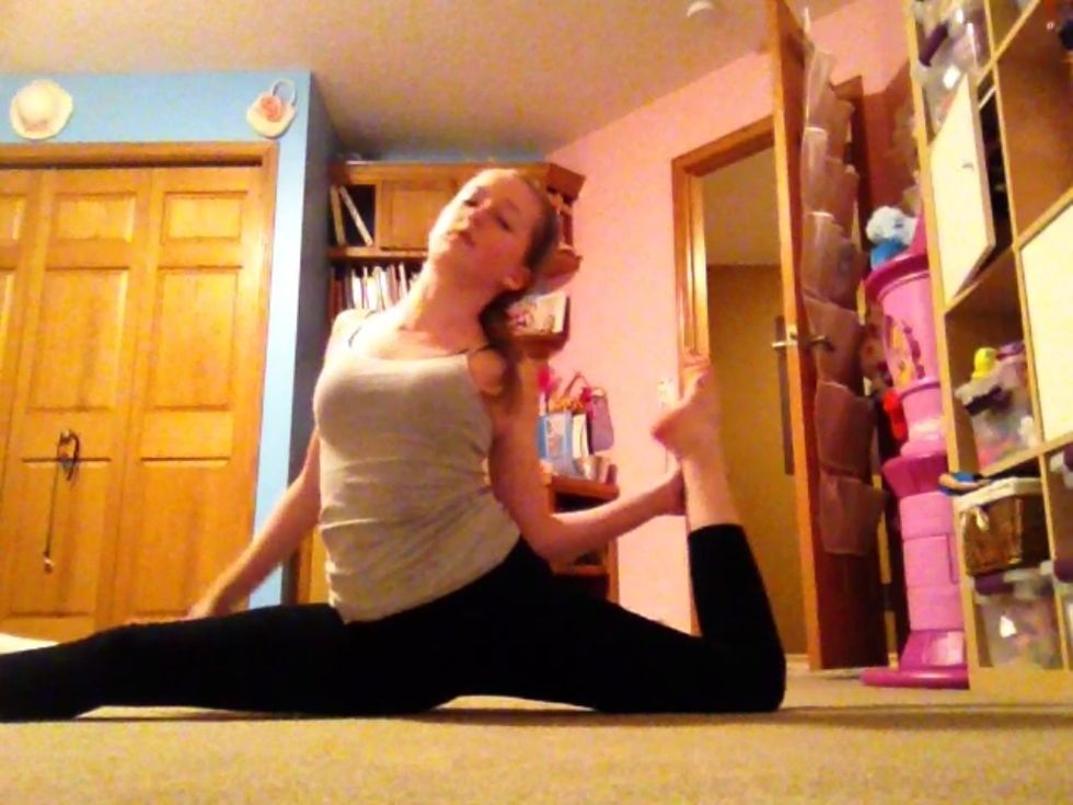 Scorpion stretch in splits: start in splits and grab your ankle with your hand...