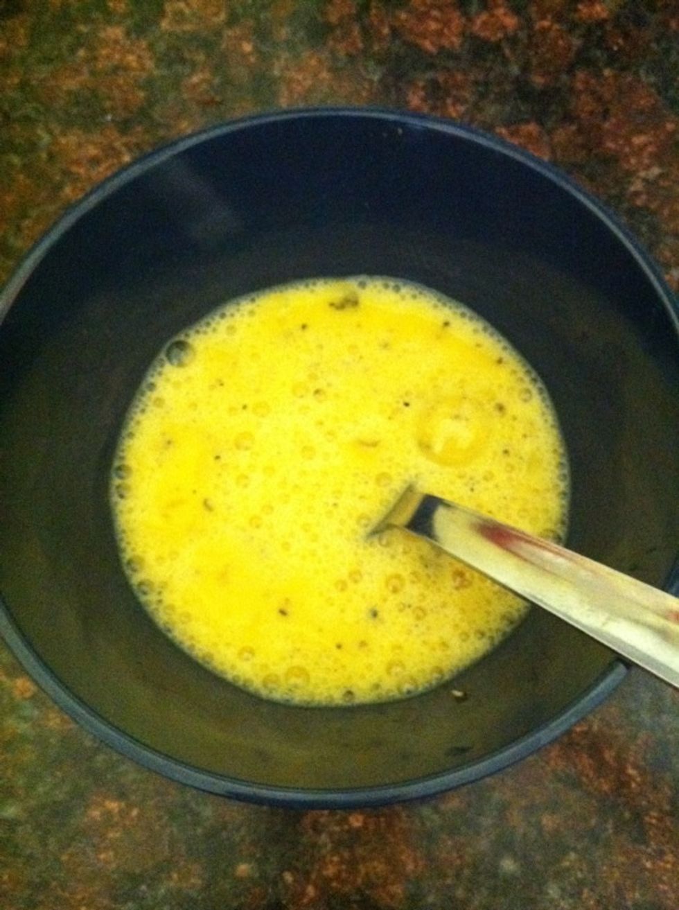 Scramble 2 eggs in a bowl. Add salt, black pepper and 3tbs of grated parmigiano reggiano.