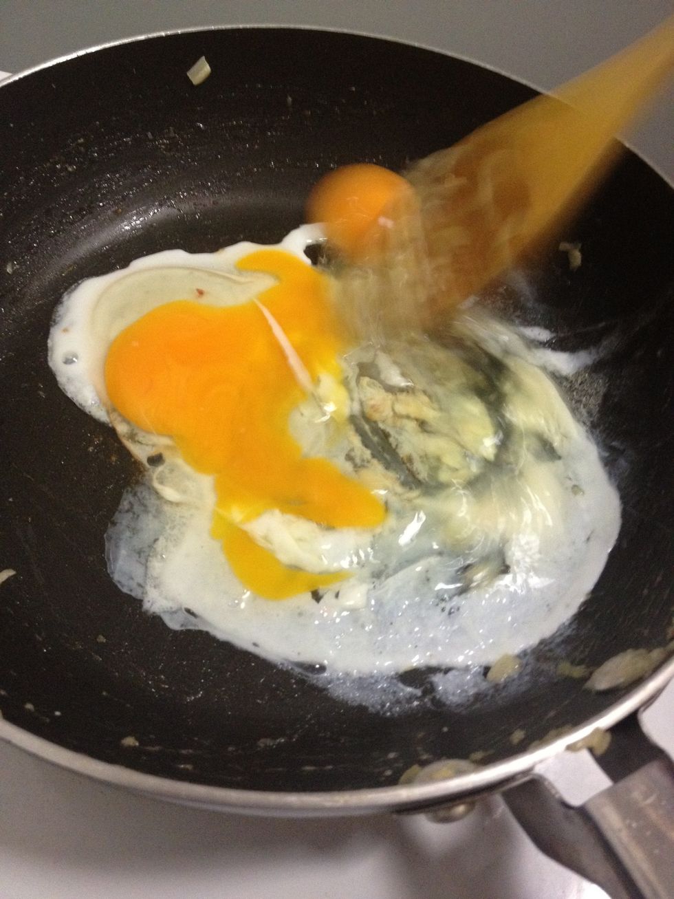 Scramble the eggs until cooked.