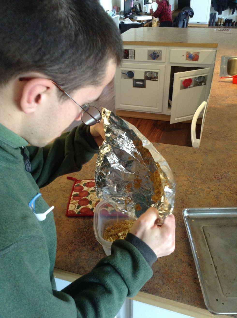 Scrap quinoa into a Tupperware dish