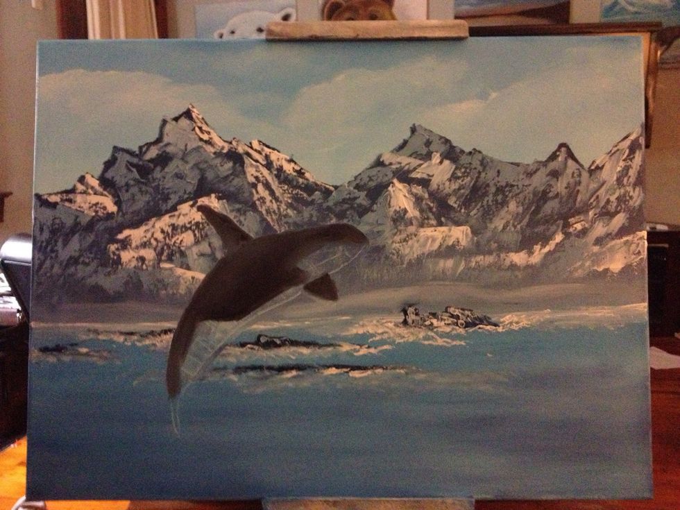 Scrape away paint with your knife in the shape of your whale. Use your pinky to block in the shape.