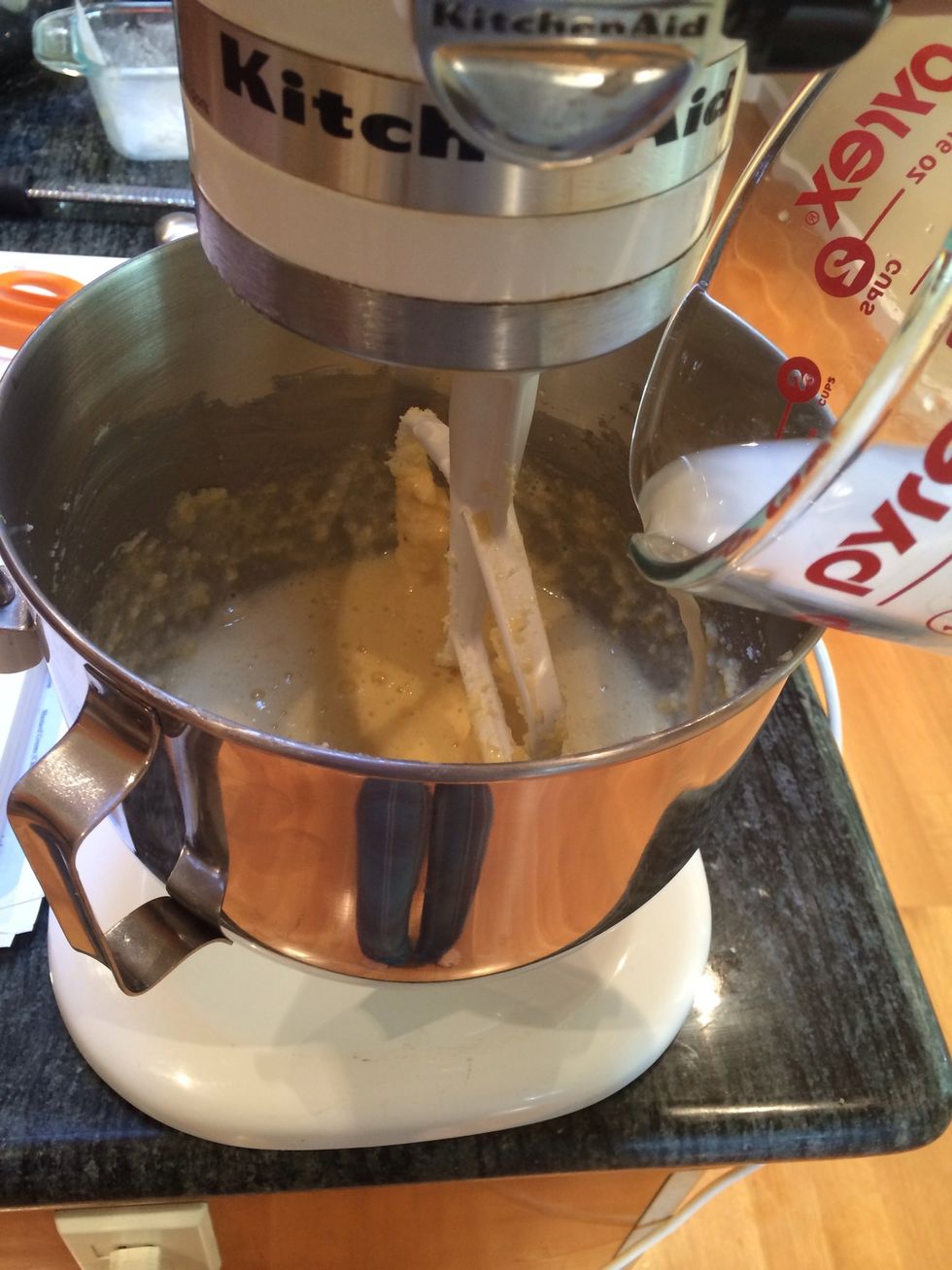 Scrape down the sides of the bowl, mix for another minute, then add the milk.