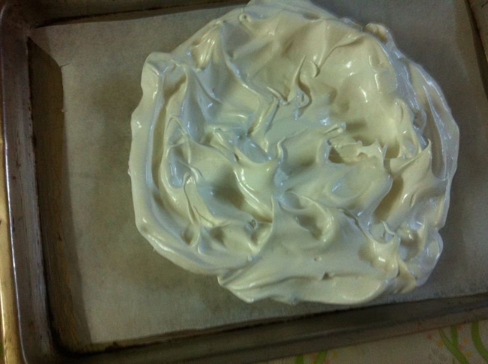 Scrape into a baking sheet lined with parchement paper. An 8 inch disk is a good size, don't make it perfect...and try to make a dent in the center.