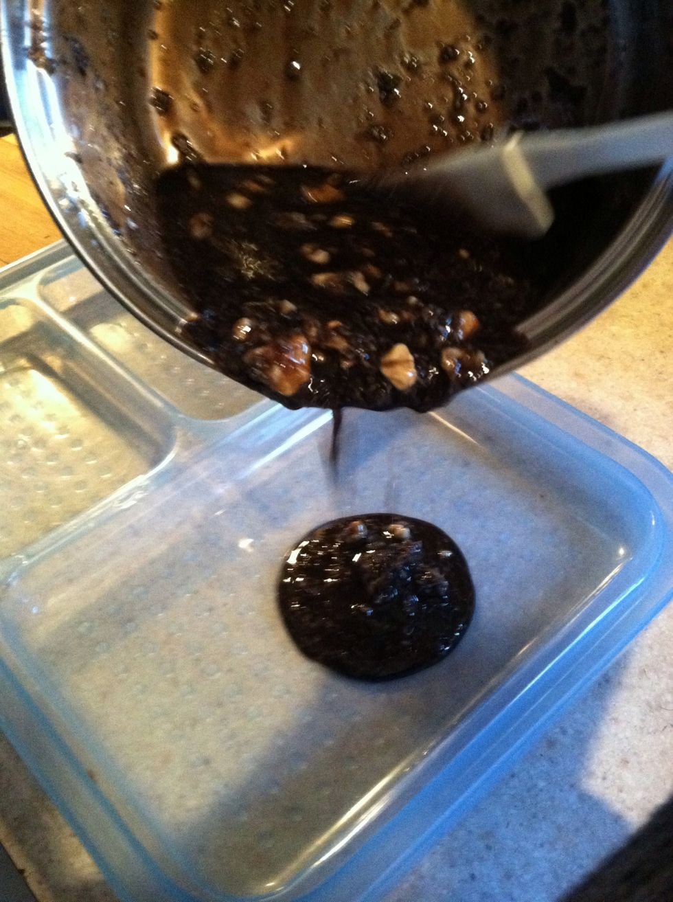 Scrape mixture out of pan and into any flat shallow container. (I am using a Tupperware lid).