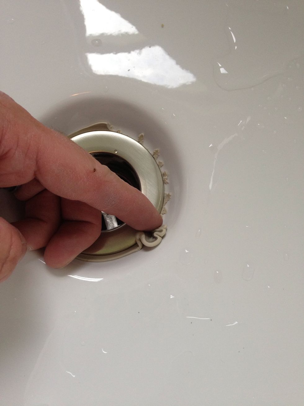 Scrape off the excess putty.