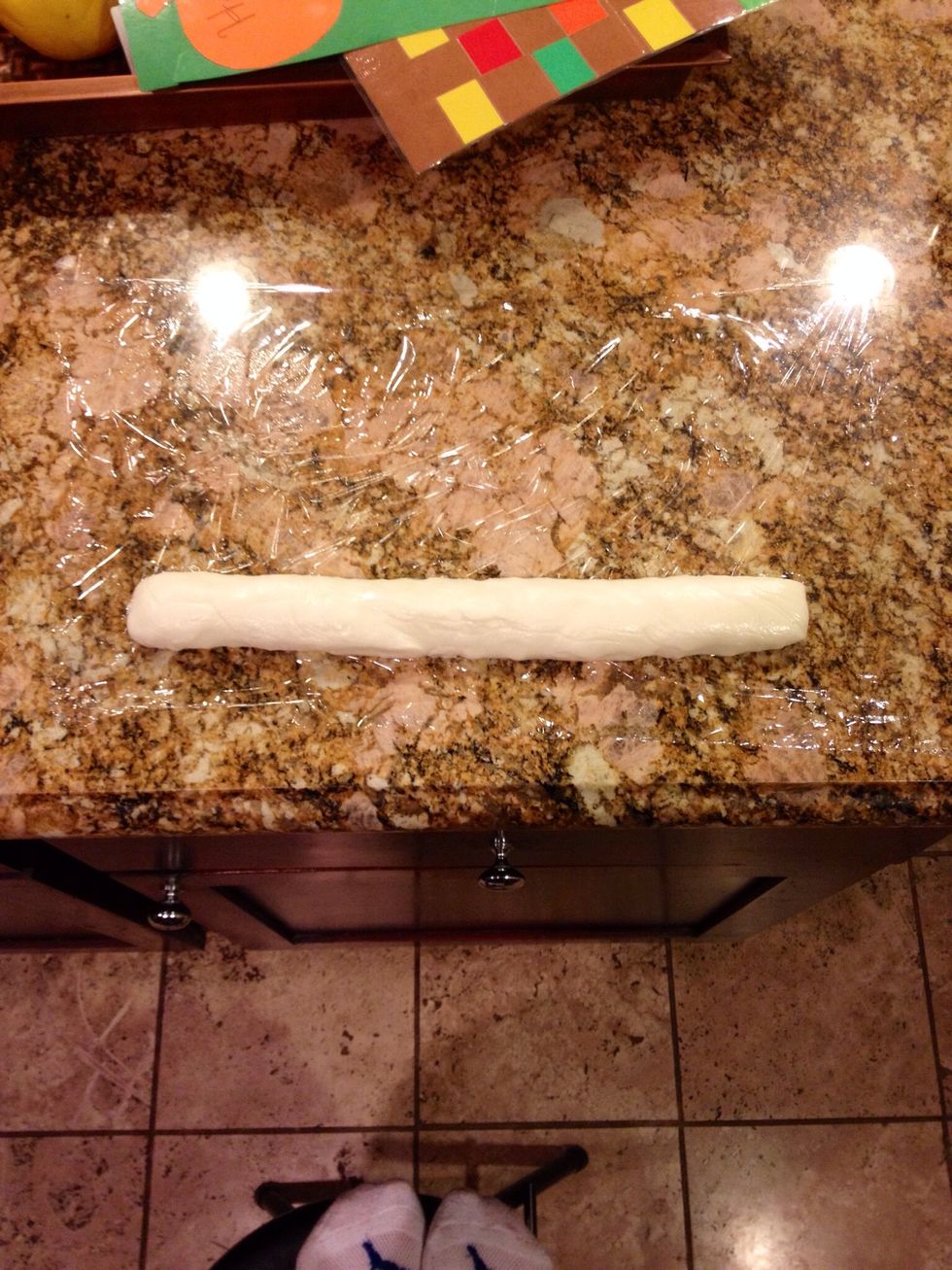 Scrape out the paste onto a plastic wrap-lined work surface. Roll it out to about a 1 1/2 inch diameter.