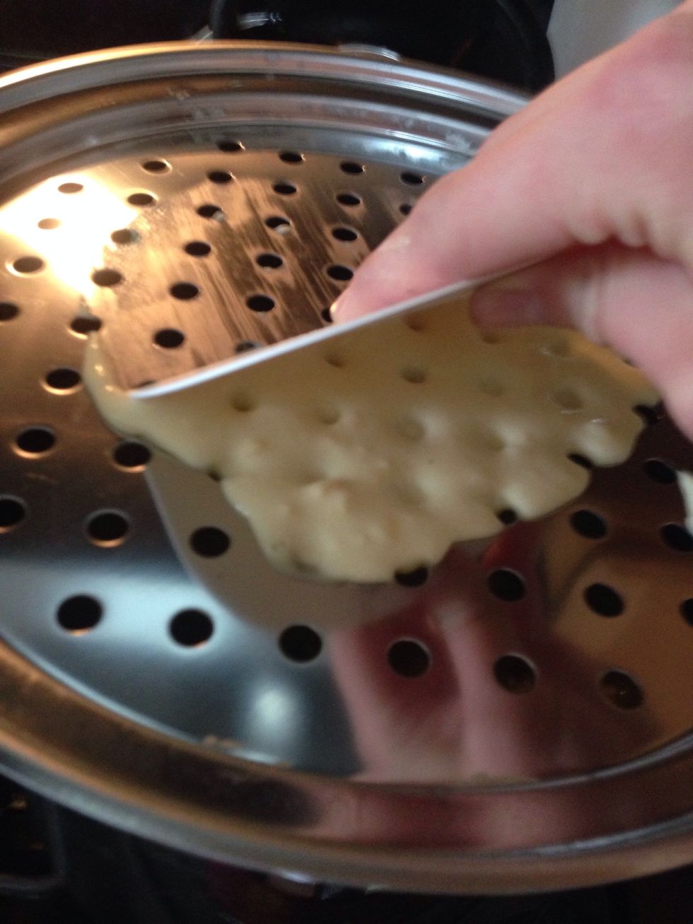 Scrape the dough into the boiling water
