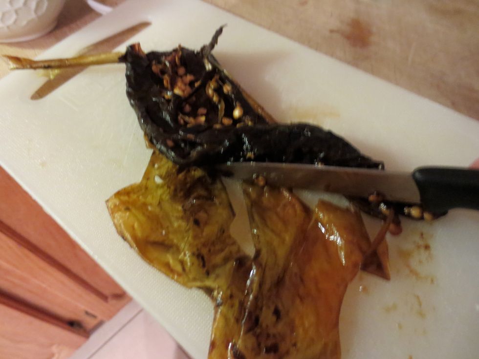 scrape the pulp from the dried chile add to the pot of veggies. You can omit the seeds if you want. Add the seasonings pepper, salt, coriander, cumin, chile, garlic plus the optional herbs and spices.