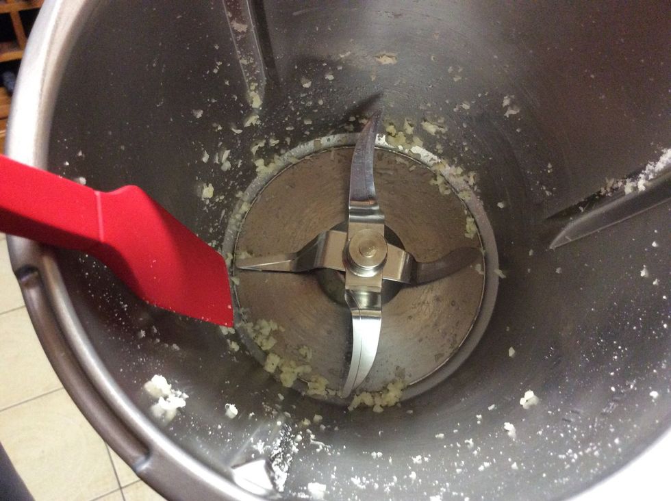 Scrape the sides of the bowl and leave the garlic inside
