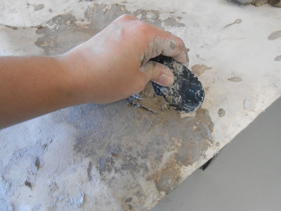 scrape the wedging table or board of extra mushy or dry clay