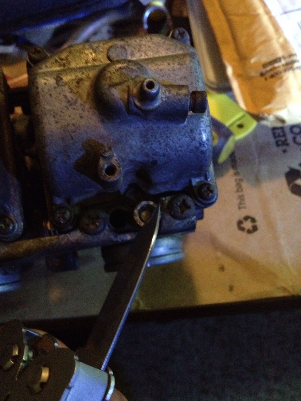 Scratch grooves on the outside in line with the screw before removing so you can put the new one in appropriately.