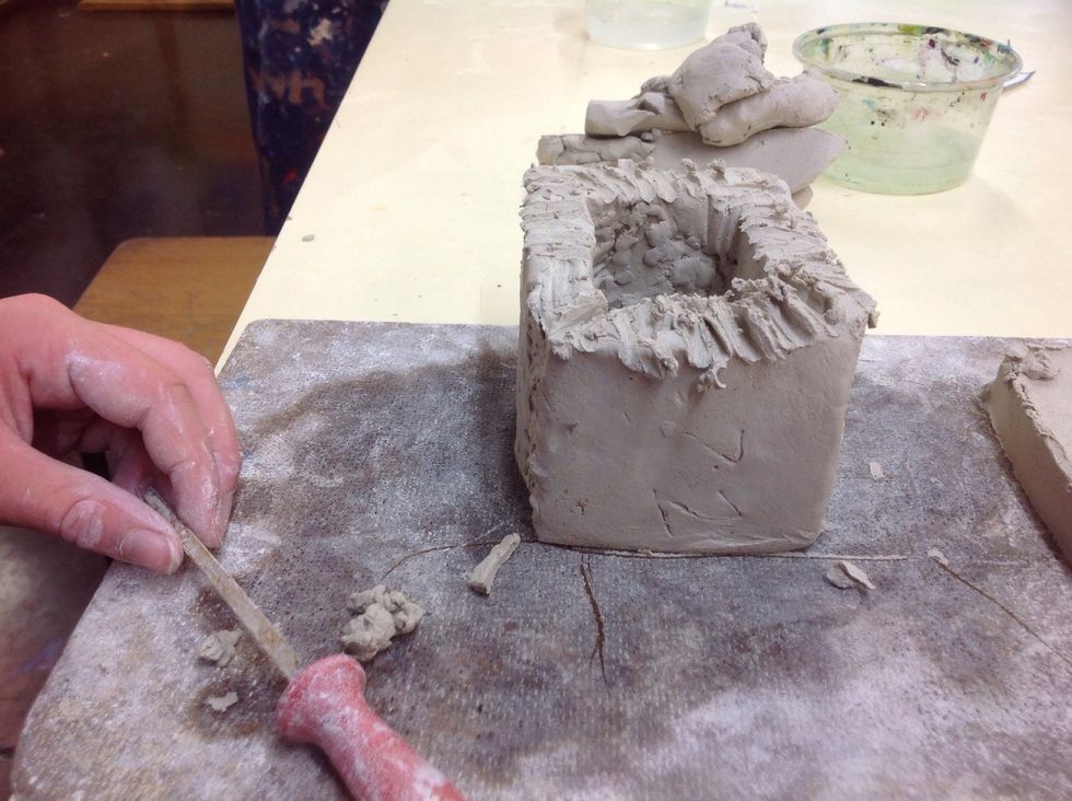 Scratch the top of the sort of cube and rub water on the scratch