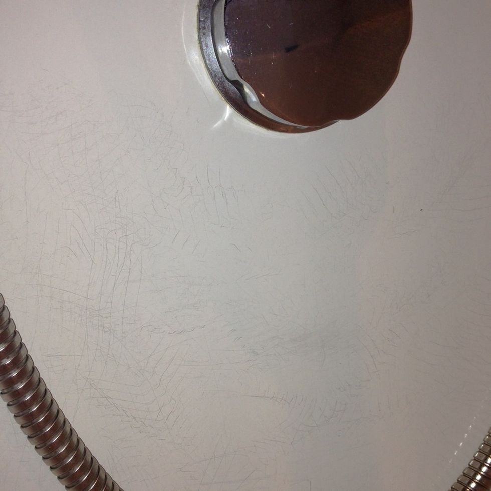 Scratches caused from shower attachment hose.
