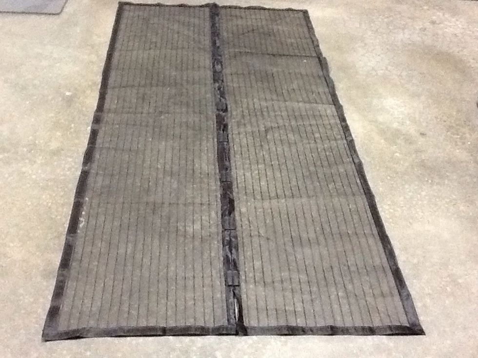 Screen laid out on floor.